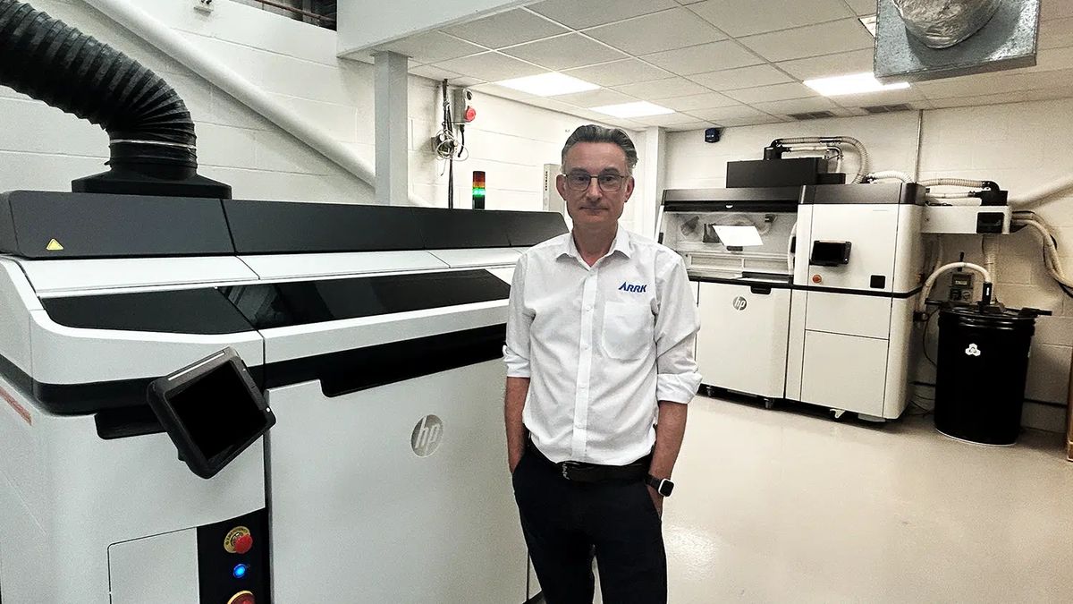 Rupert Sleightholme, General Manager, beside the HP MJF printer in Gloucester